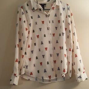 Long sleeved sheer white and bug shirt